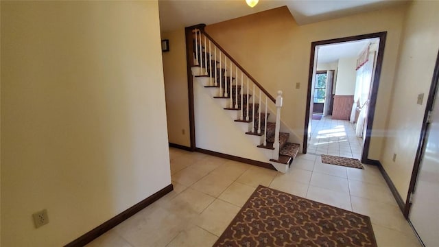 foyer entrance featuring light tile patterned floors