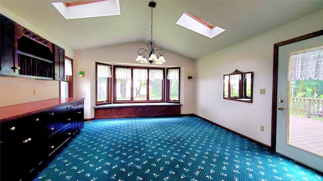 unfurnished living room featuring dark carpet, a notable chandelier, and vaulted ceiling with skylight