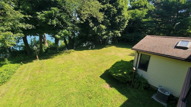 view of yard with central AC unit