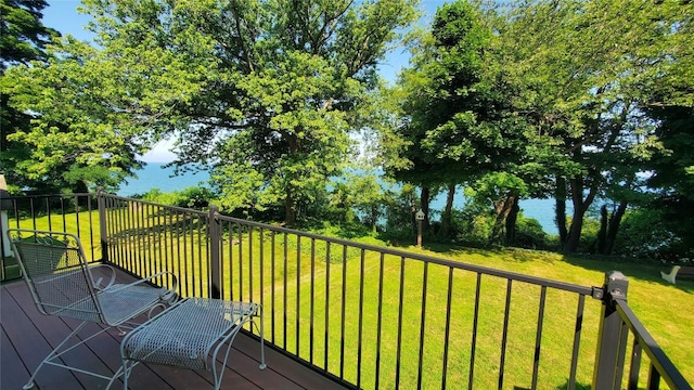 wooden terrace with a yard