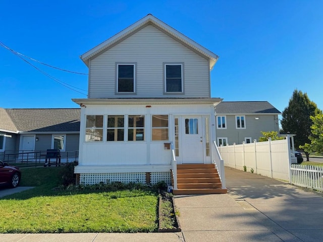 view of front of property with a front lawn