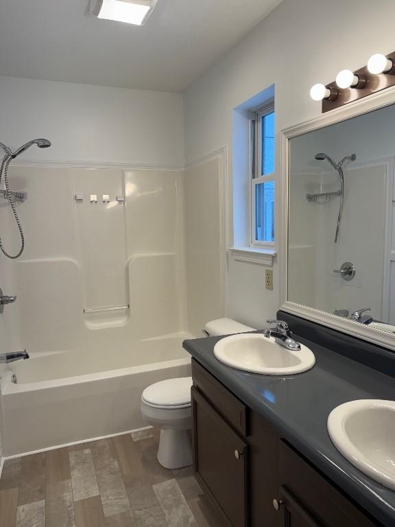 full bathroom with vanity, toilet, and shower / bath combination