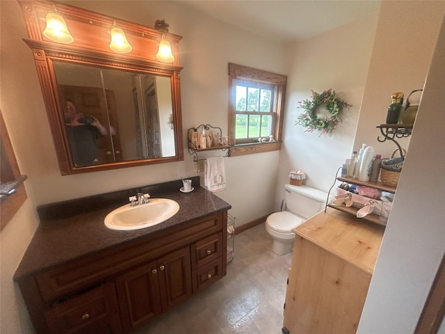 bathroom with vanity and toilet