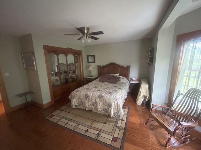 bedroom with hardwood / wood-style flooring and ceiling fan