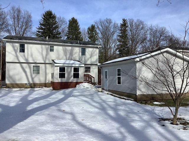 view of snow covered house