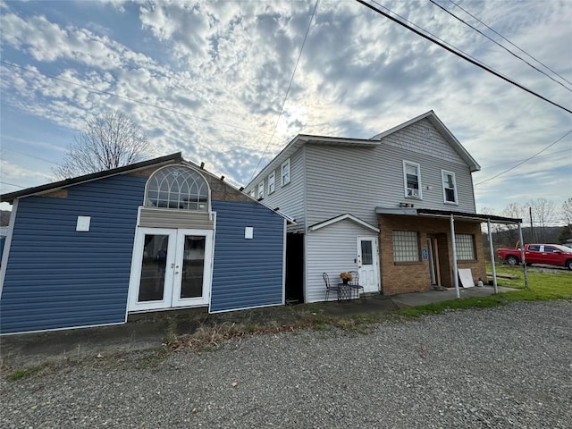 rear view of property featuring french doors