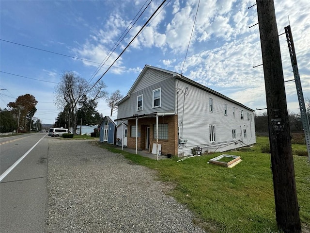 view of property exterior featuring a yard