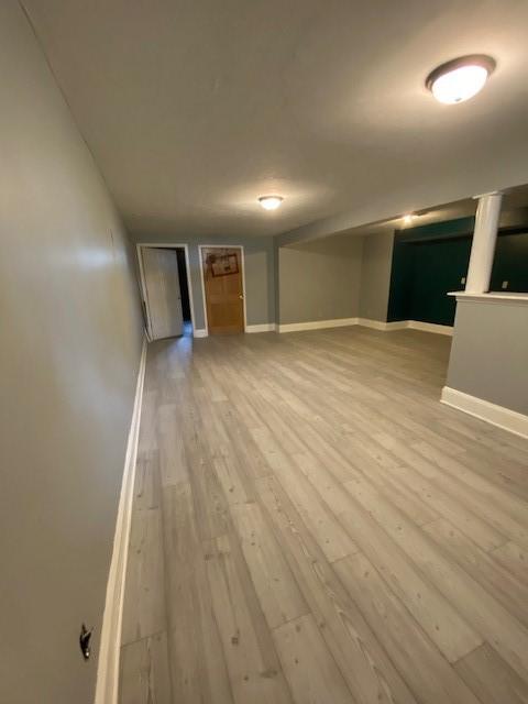 2156 Depot St, Waterford, PA 16441 - unfurnished living room featuring wood-type flooring and baseboards
