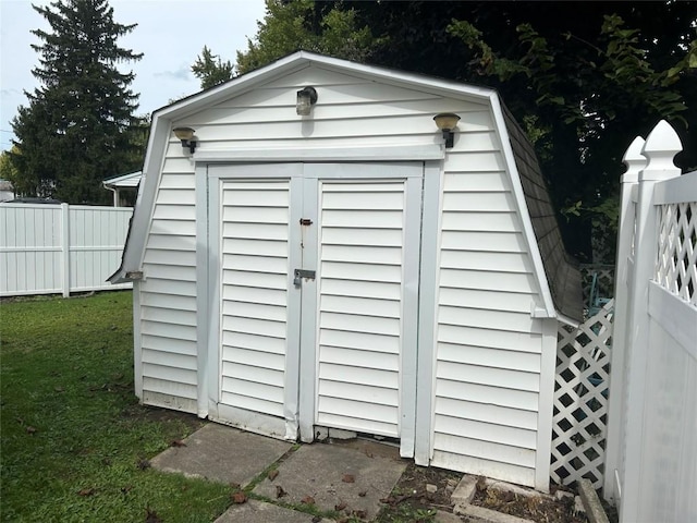 view of outdoor structure featuring a lawn