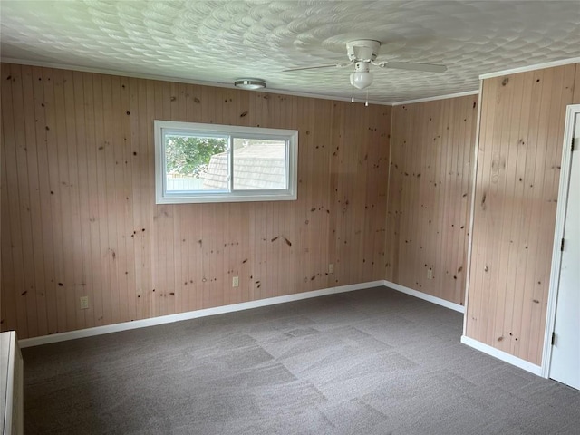 unfurnished room with dark colored carpet and wooden walls