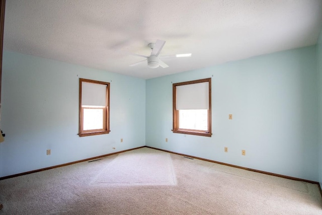 5130 W Stancliff Rd, Mckean, PA 16426 - spare room featuring light colored carpet, baseboards, a ceiling fan, and visible vents
