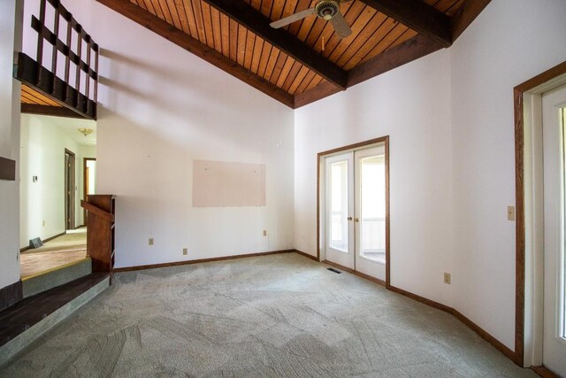 5130 W Stancliff Rd, Mckean, PA 16426 - unfurnished living room with a ceiling fan, wood ceiling, french doors, beamed ceiling, and carpet flooring