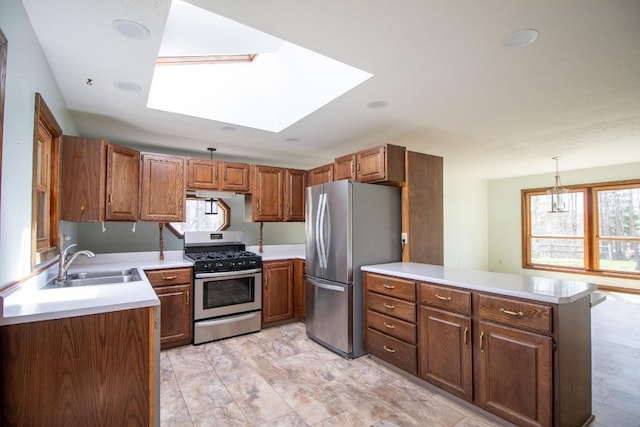 5130 W Stancliff Rd, Mckean, PA 16426 - kitchen with stainless steel appliances, a peninsula, a sink, a skylight, and light countertops