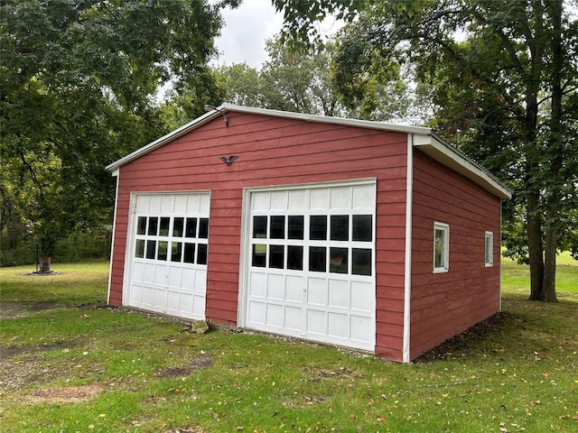 garage with a lawn