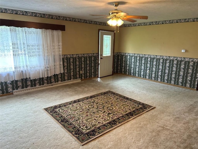 unfurnished room with ceiling fan