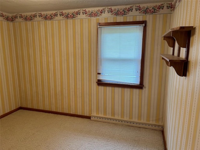 unfurnished room featuring a baseboard radiator