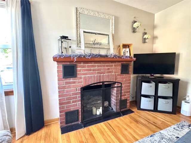 3524 French St, Erie, PA 16504 - living room featuring a fireplace and wood finished floors