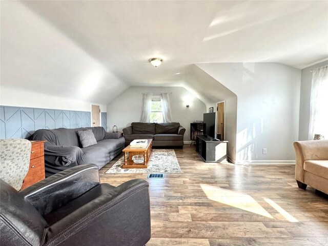 3524 French St, Erie, PA 16504 - living area featuring vaulted ceiling and wood finished floors
