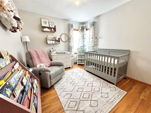 3524 French St, Erie, PA 16504 - bedroom featuring wood finished floors and a nursery area