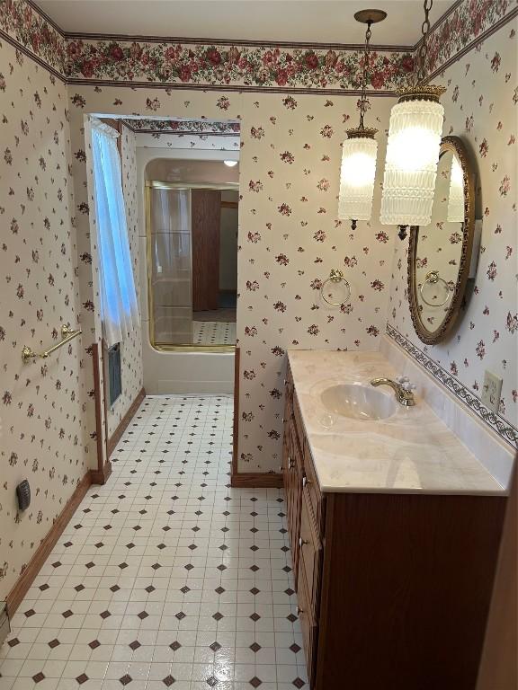 6848 6th Hwy, Linesville, PA 16424 - bathroom with wallpapered walls, vanity, tile patterned floors, and baseboards