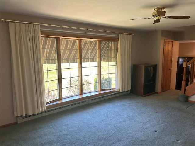 6848 6th Hwy, Linesville, PA 16424 - unfurnished living room featuring a baseboard radiator, carpet floors, and ceiling fan
