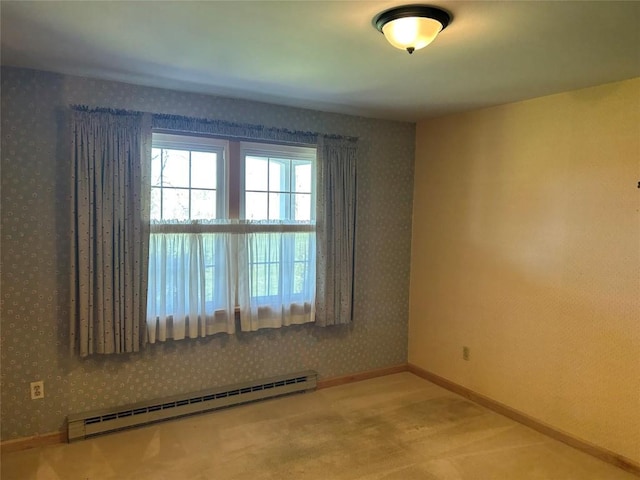 6848 6th Hwy, Linesville, PA 16424 - carpeted empty room featuring wallpapered walls, baseboards, and baseboard heating