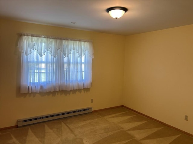 6848 6th Hwy, Linesville, PA 16424 - spare room featuring a baseboard heating unit, baseboards, and carpet