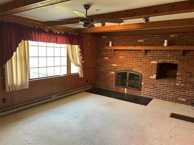 6848 6th Hwy, Linesville, PA 16424 - unfurnished living room featuring a baseboard radiator, ceiling fan, beamed ceiling, a fireplace, and carpet flooring