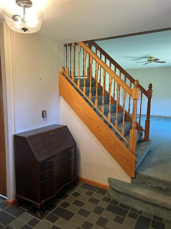 6848 6th Hwy, Linesville, PA 16424 - stairs with a ceiling fan and baseboards