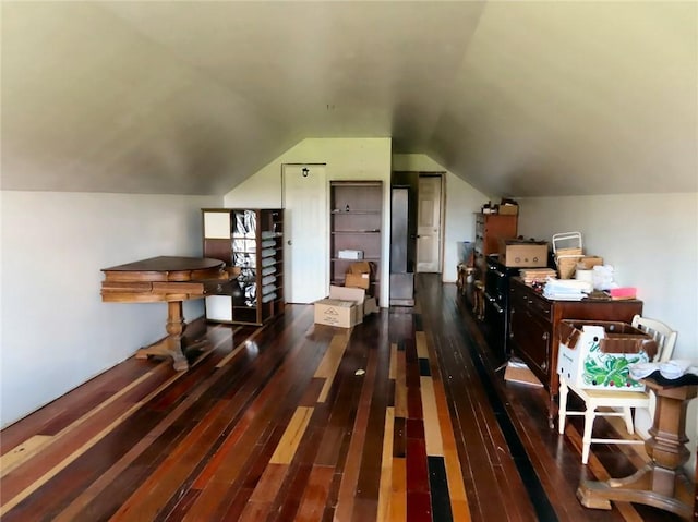 bonus room featuring lofted ceiling and dark wood-type flooring