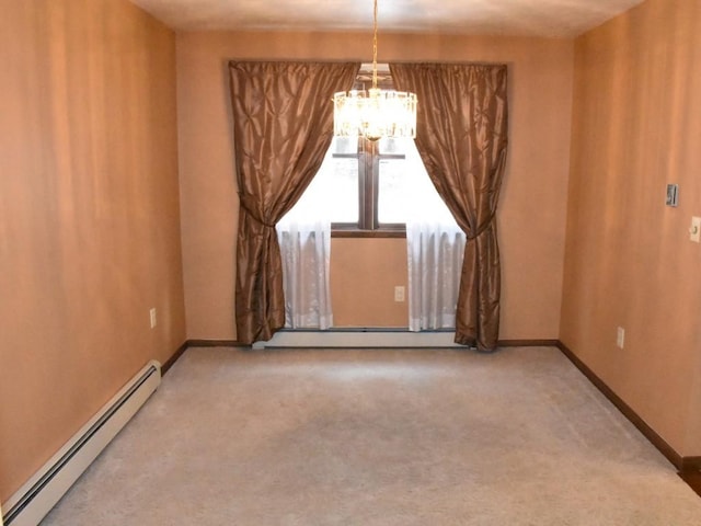 carpeted spare room with a baseboard heating unit, baseboards, and an inviting chandelier