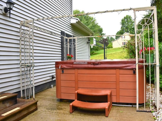 exterior space with a hot tub