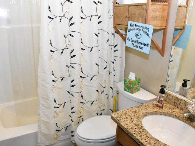 bathroom with toilet, shower / tub combo with curtain, and vanity