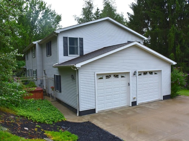 view of property exterior featuring an attached garage