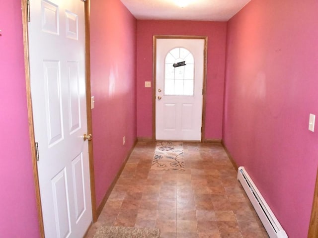 entryway with baseboards and baseboard heating