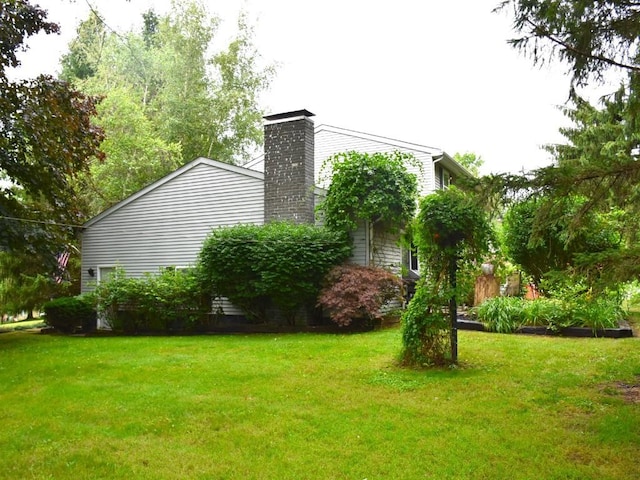 view of home's exterior featuring a lawn