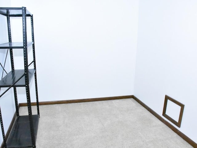 interior space featuring baseboards and carpet flooring