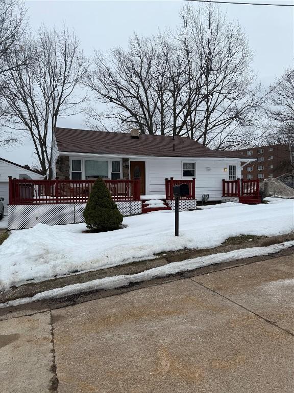 view of front of home featuring a wooden deck