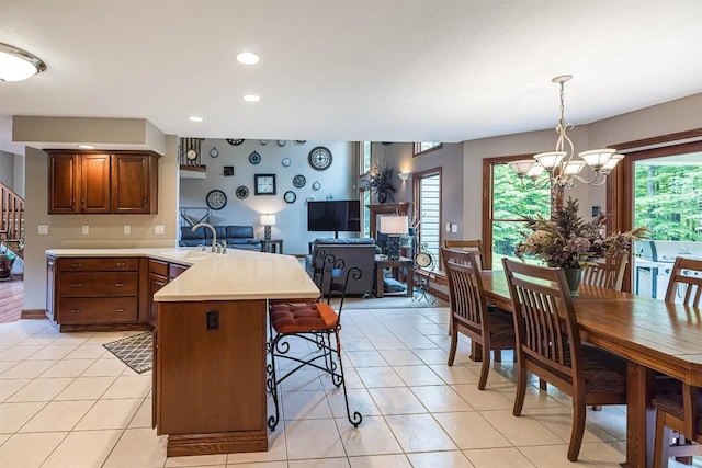10170 Tiger Lily Ln, Waterford, PA 16441 - kitchen featuring a peninsula, light countertops, a sink, a chandelier, and recessed lighting