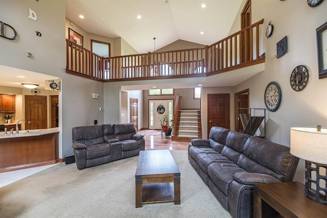 10170 Tiger Lily Ln, Waterford, PA 16441 - living area with high vaulted ceiling, stairs, recessed lighting, and light carpet