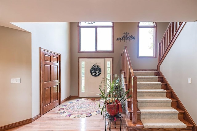 10170 Tiger Lily Ln, Waterford, PA 16441 - foyer with stairs, light wood-style floors, baseboards, and a towering ceiling