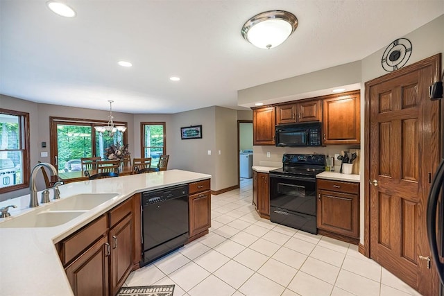 10170 Tiger Lily Ln, Waterford, PA 16441 - kitchen featuring black appliances, a sink, light countertops, recessed lighting, and light tile patterned floors