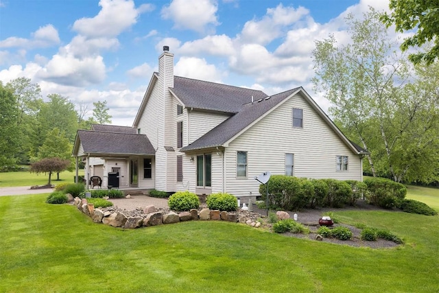 10170 Tiger Lily Ln, Waterford, PA 16441 - back of property featuring a yard, a chimney, and a shingled roof