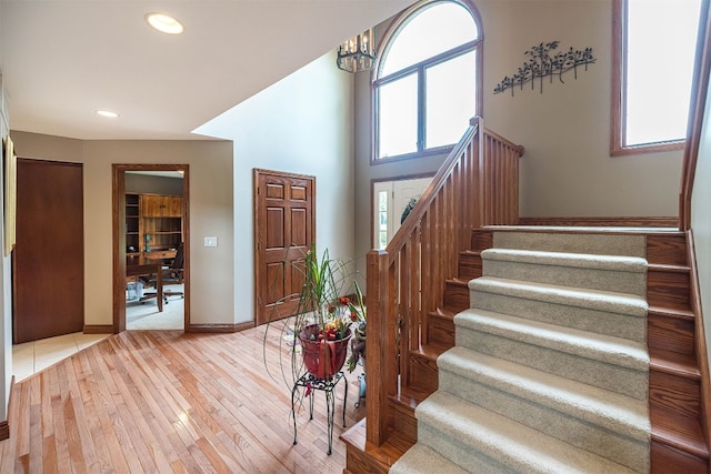 10170 Tiger Lily Ln, Waterford, PA 16441 - entrance foyer featuring stairway, light wood finished floors, a chandelier, baseboards, and recessed lighting