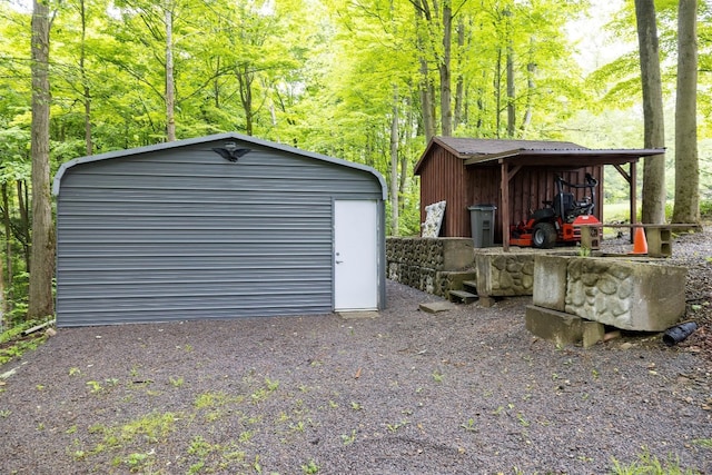 10170 Tiger Lily Ln, Waterford, PA 16441 - garage with a storage shed