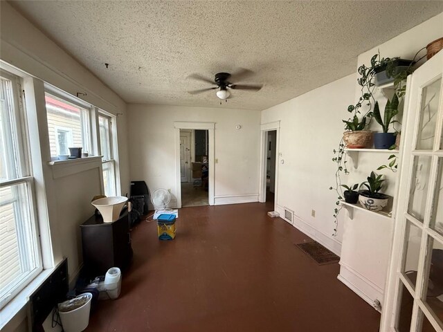 1146 W 5th St, Erie, PA 16502 - kitchen with freestanding refrigerator, ceiling fan, black range with gas cooktop, a textured ceiling, and stainless steel microwave