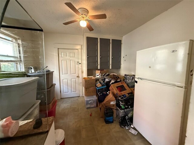 1146 W 5th St, Erie, PA 16502 - carpeted living area with a textured ceiling and ceiling fan