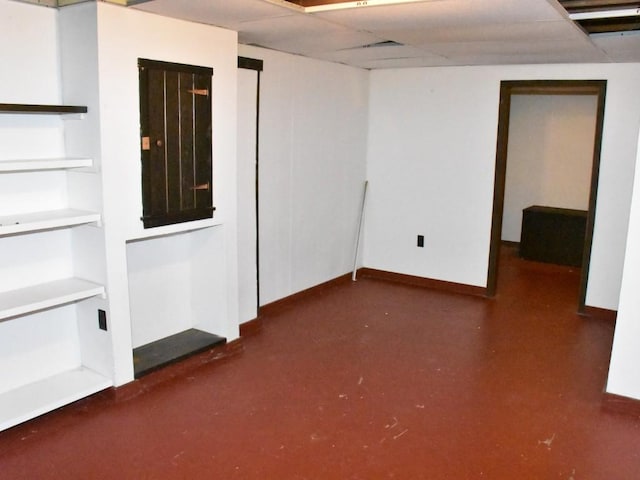 interior space featuring baseboards and finished concrete floors