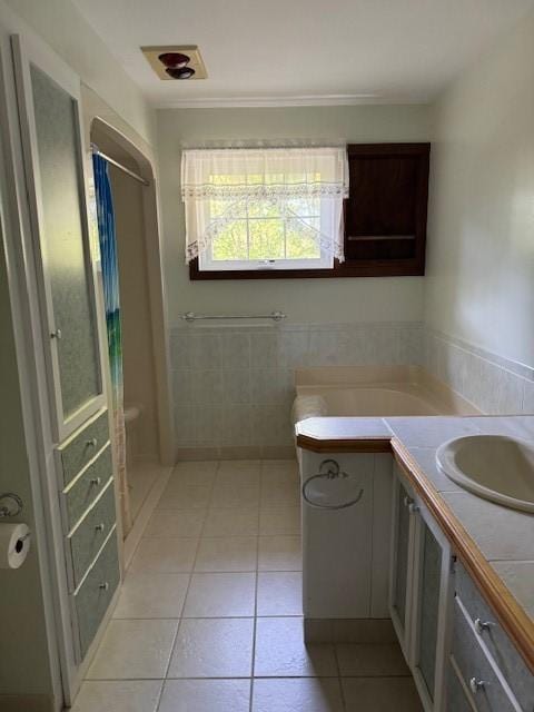 bathroom featuring tile patterned floors, a shower with curtain, and vanity