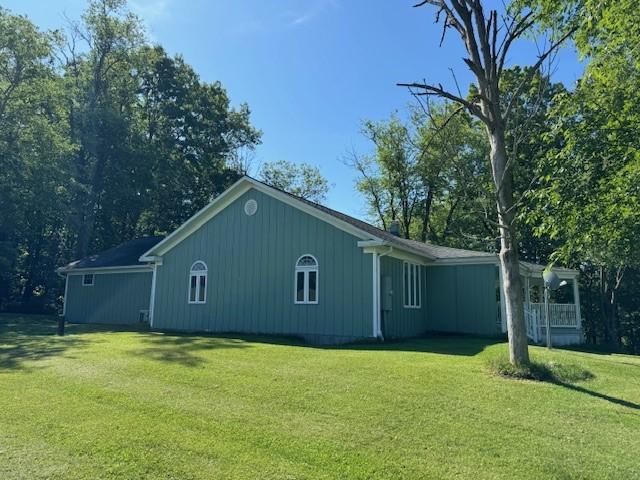 view of property exterior featuring a yard